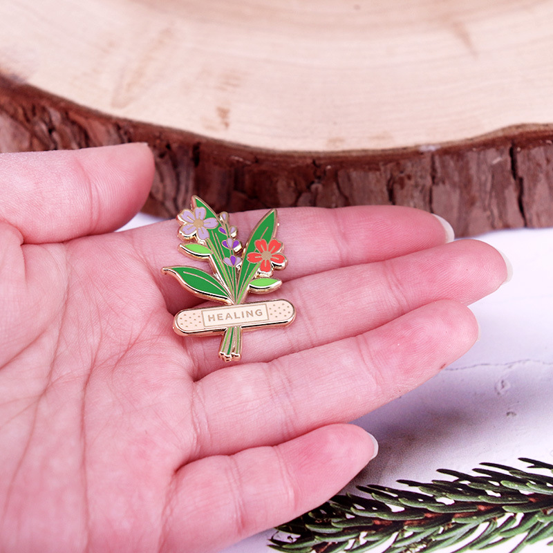 1 unidade de Broche Esmaltado  - Herbal Wellness Healthcare avaliação e preço